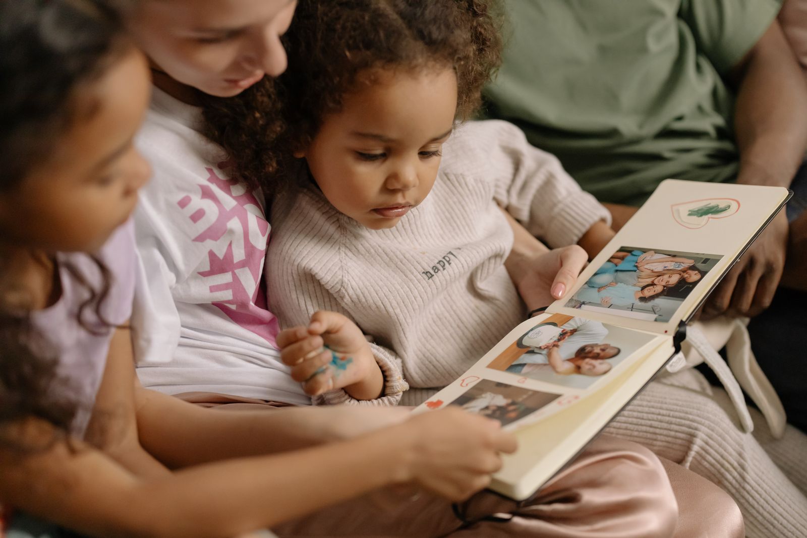 Parent and child looking through a personalised story book together